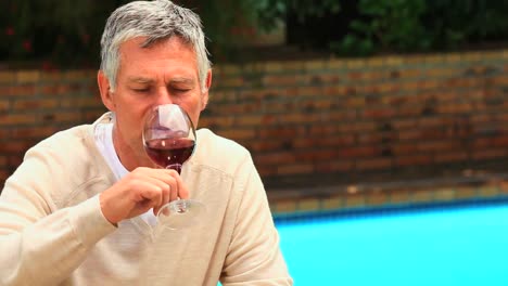 Mature-man-enjoying-a-glass-of-red-wine