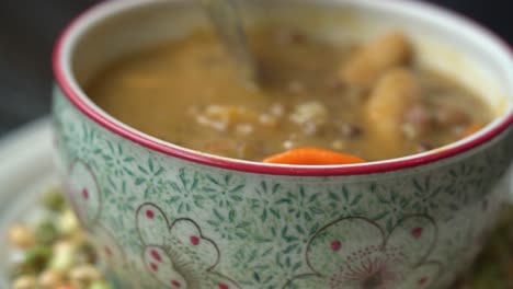 spoon dipping soup preparing jamaican gungo pea soup after being picked from tree healthy green fresh protein cultivation harvested