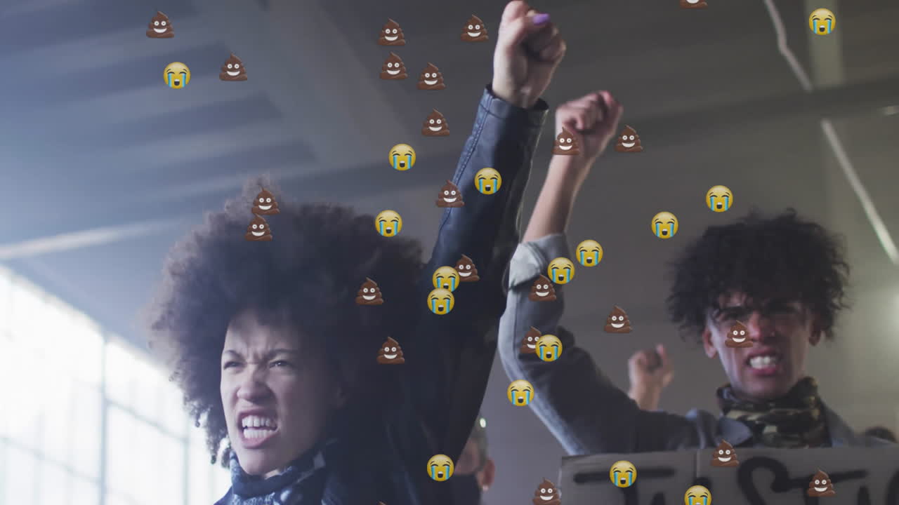 Activists raising fists inside warehouse, showing justice sign with emoji overlays for activism