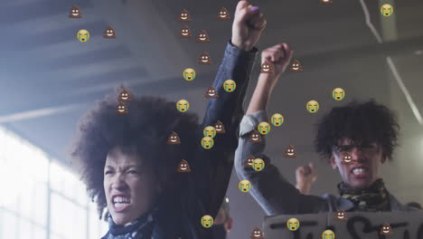 activists raising fists inside warehouse, showing justice sign with emoji overlays for activism
