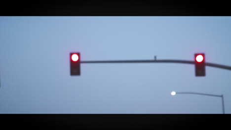 traffic lights over highway seen through open roof of car