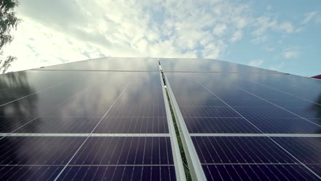 Solar-Cell-Panels-With-Clouds-And-Blue-Sky-In-The-Background-On-A-Sunny-Day