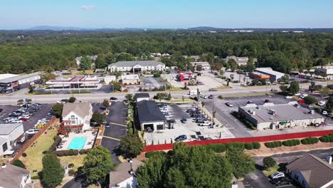 community car wash, slow drone pan with mountains in background, mauldin south carolina