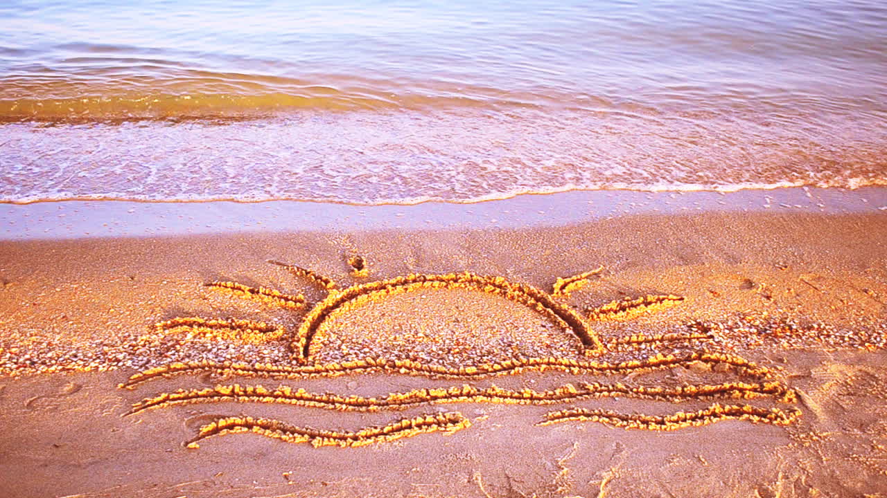 Sun drawing on the beach. Beach and drawing