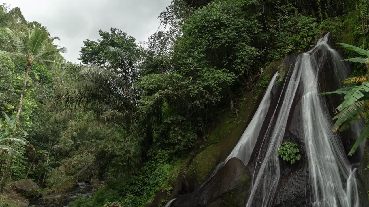 Tropical Waterfall in Lush Rainforest