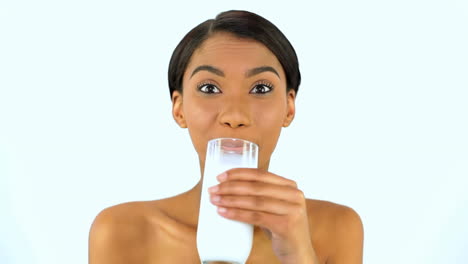 woman drinking a glass of milk