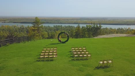 wedding-venue-and-chairs-on-field-on-sunny-day-upper-view
