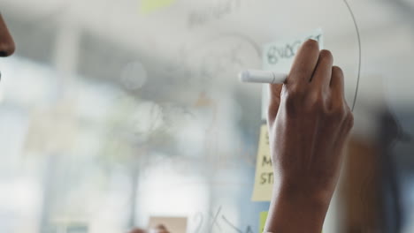 Black-woman,-hands-and-writing-in-schedule