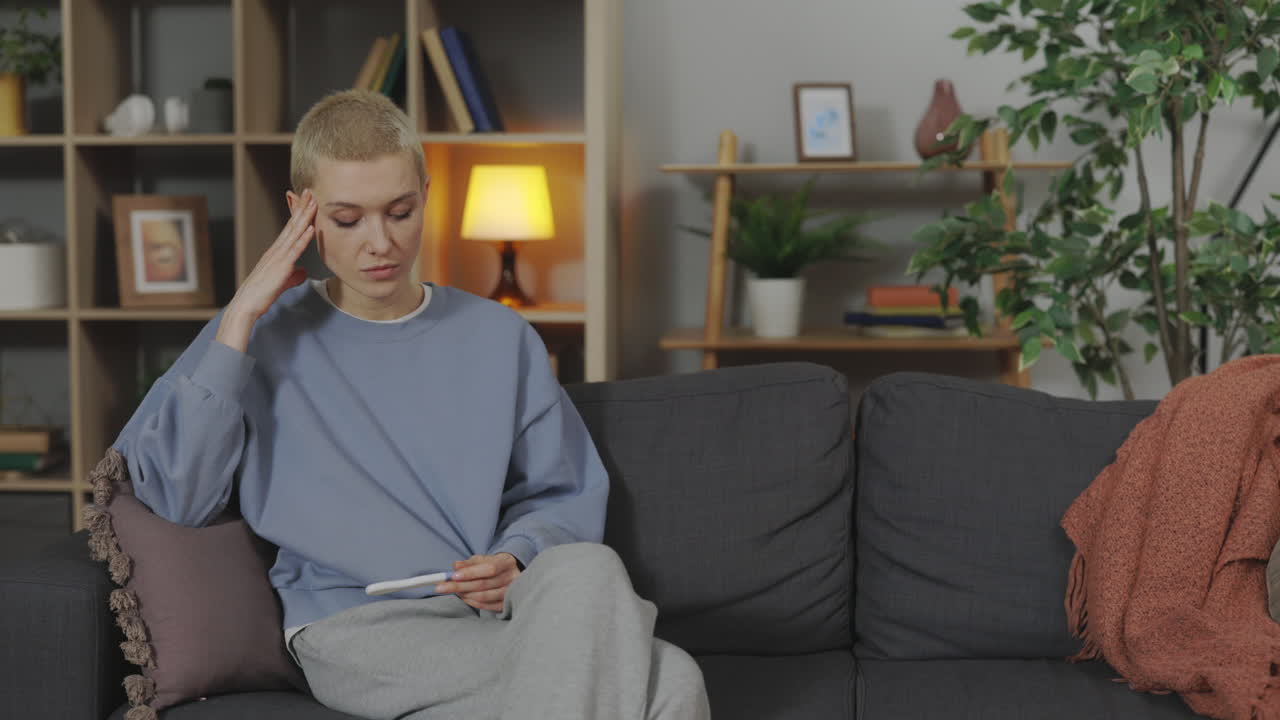 Woman anxiously waiting for pregnancy test results