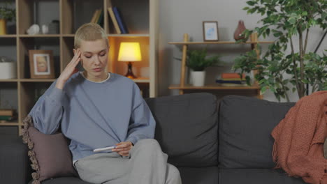 woman anxiously waiting for pregnancy test results