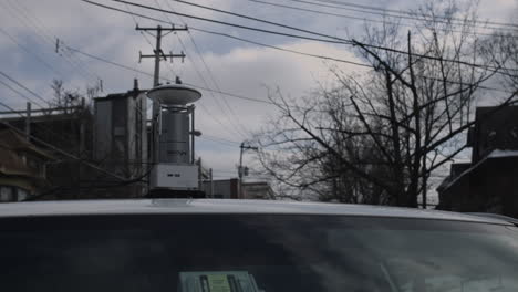 roof mounted lidar scanning device used for 3d mapping of city streets
