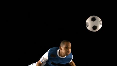 football player heading the ball