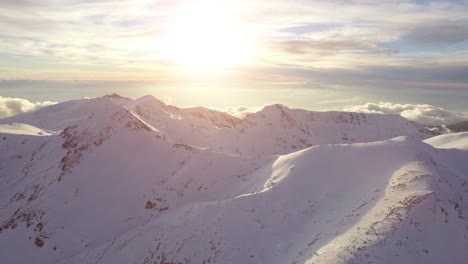 snow-capped mountains at sunrise/sunset