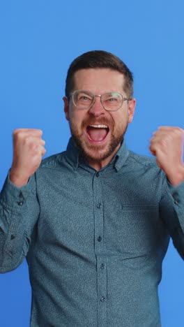 happy caucasian man celebrate success winning birthday lottery jackpot goal achievement good news