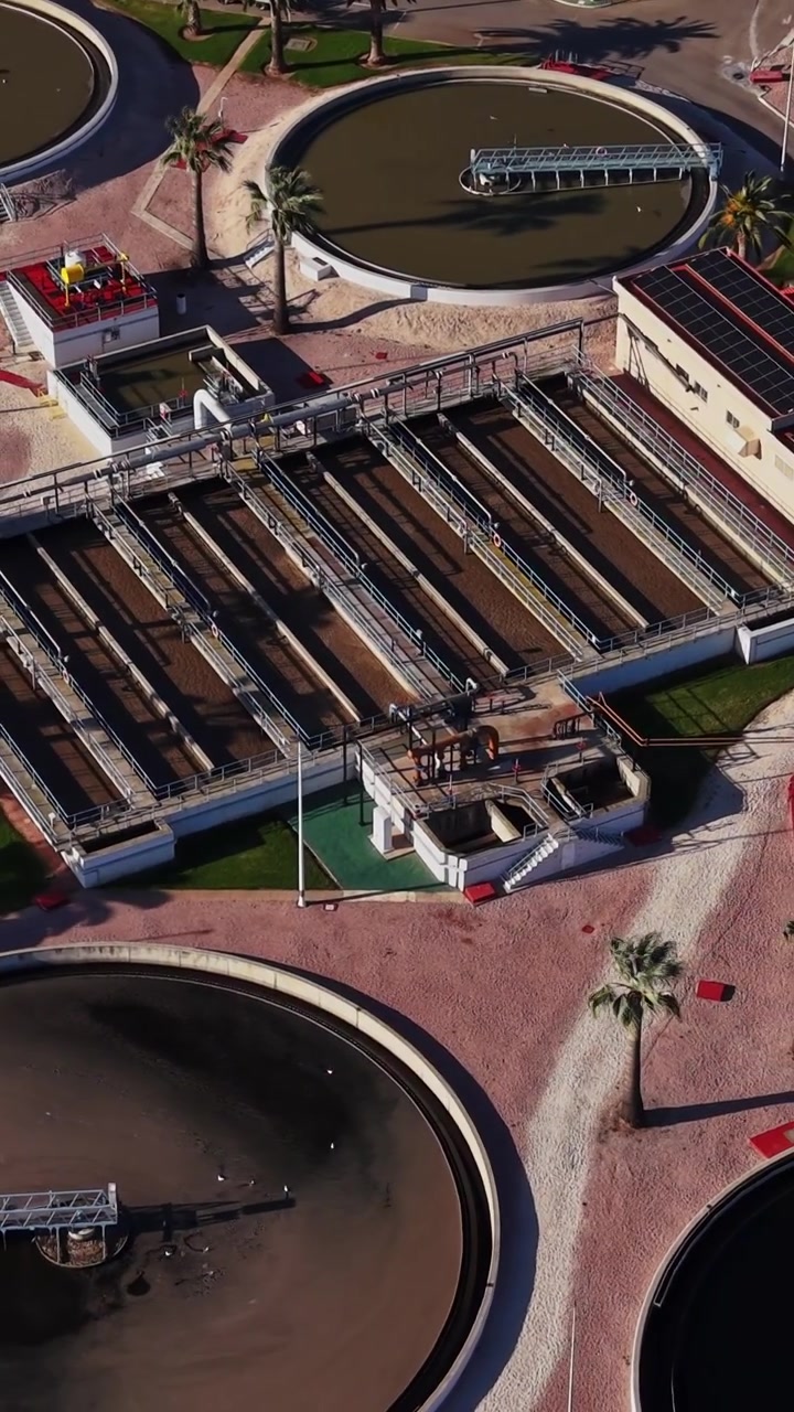 Wastewater treatment plant in Spain shows circular tanks and equipment