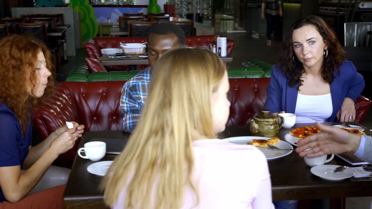 Friends Enjoying Lunch in a Restaurant