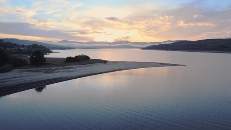 aerial drone shot of sunset on the lake