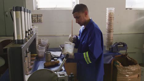 mixed race man working in factory