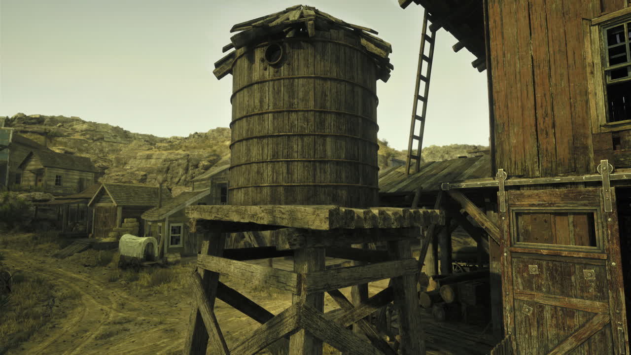 Old wooden water tower in a deserted western town during the day
