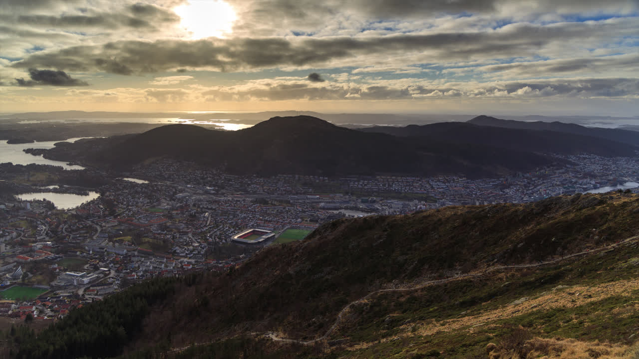 From one of the many viewpoints on mount Ulriken in Bergen. People hiking towards the summit.