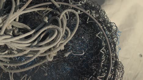 Close-shot-of-fishing-ropes-and-nets-on-the-deck-of-a-fishing-boat