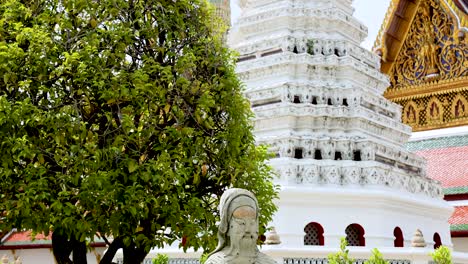 ancient statues and temple architecture in bangkok