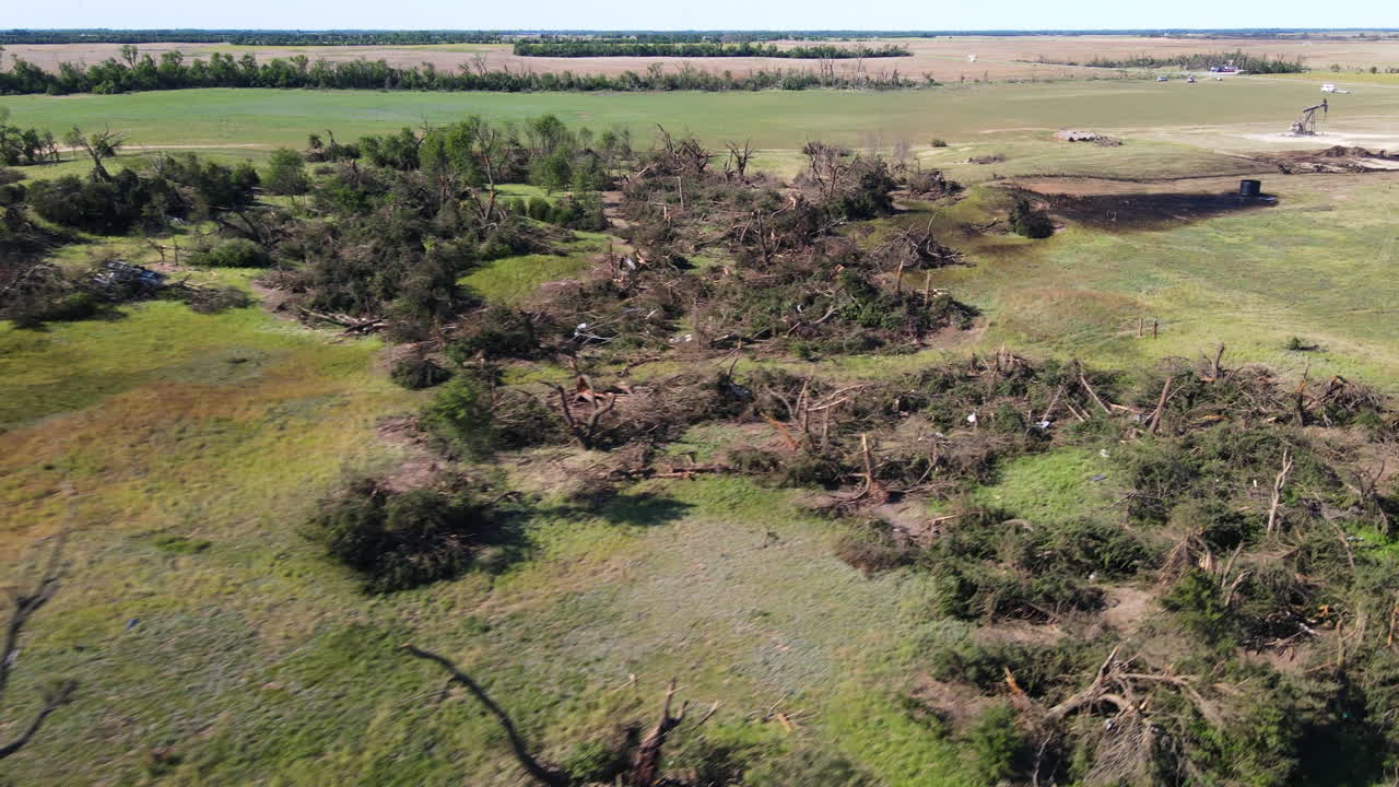 Aerial view over fallen trees, Tornado destruction in Kansas, USA, sunny day