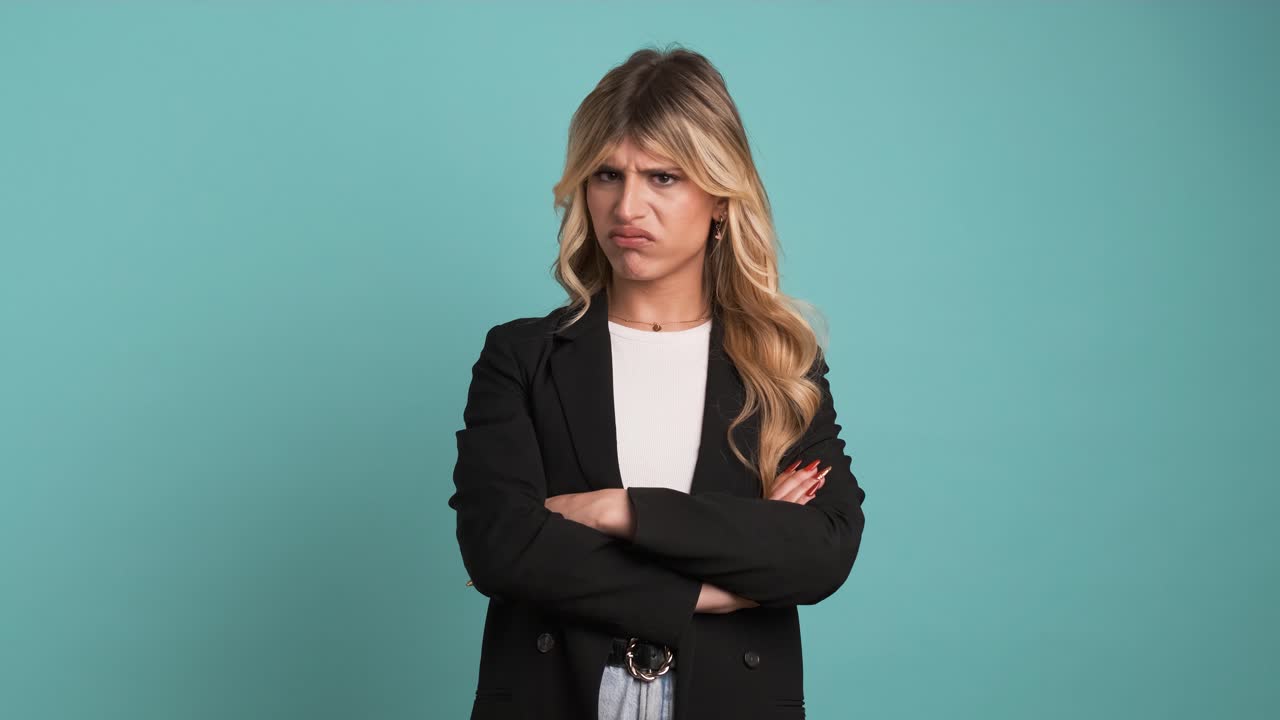 Angry transgender businesswoman shaking lips and frowning