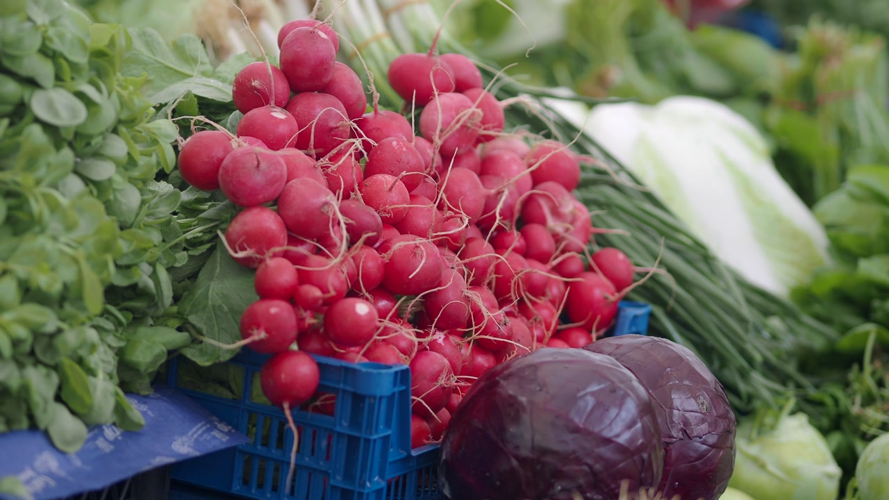 Fresh Radishes and Vegetables on Display at a Market