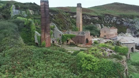 porth wen aerial orbiting view abandoned victorian industrial brickwork factory remains on anglesey eroded coastline