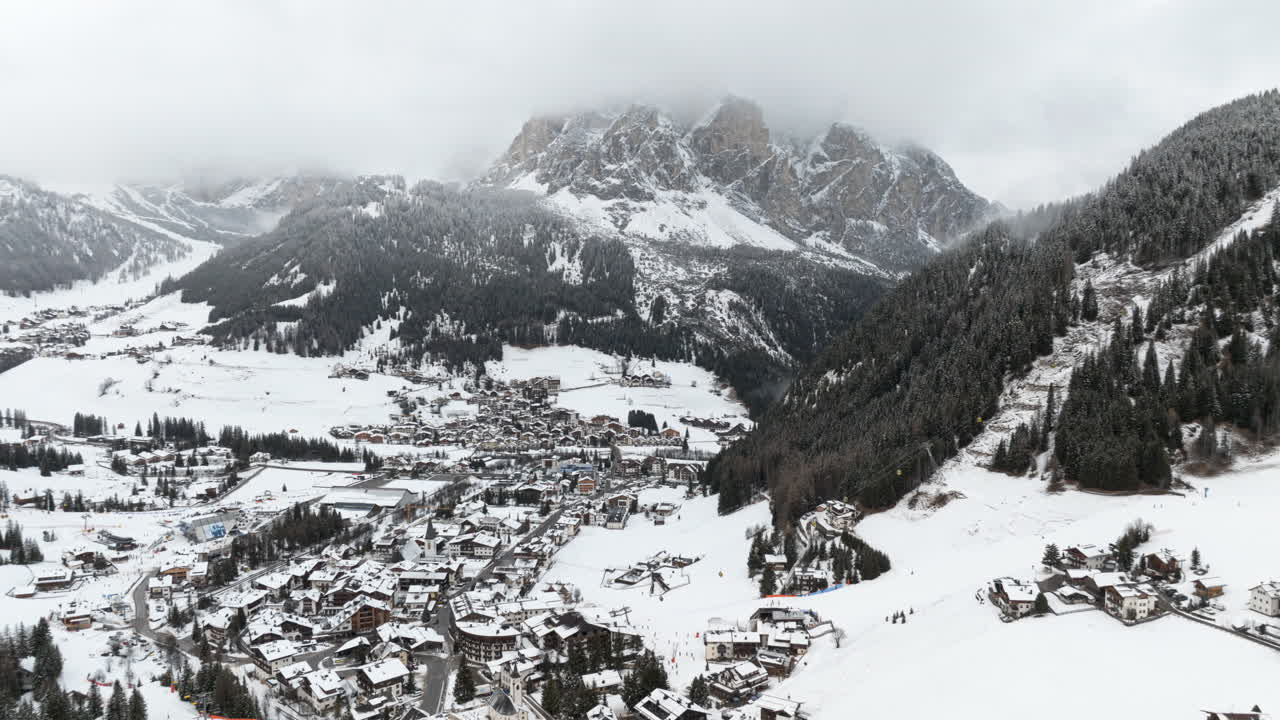 Aerial hyperlapse timelapse of Corvara village in Dolomites mountains. Winter season