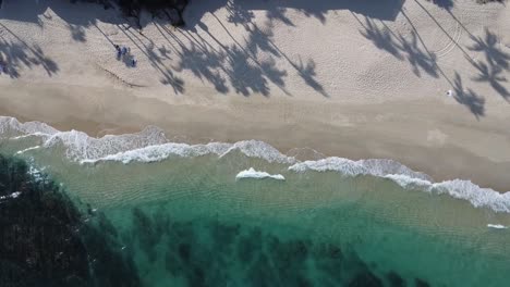 Bird-eye-aerial-of-Palmilla-Beach-in-Cabo-San-Lucas,-an-slice-of-paradise-on-the-southern-tip-of-the-Baja-California-Peninsula,-with-its-pristine-sandy-shores-and-crystal-clear-waters