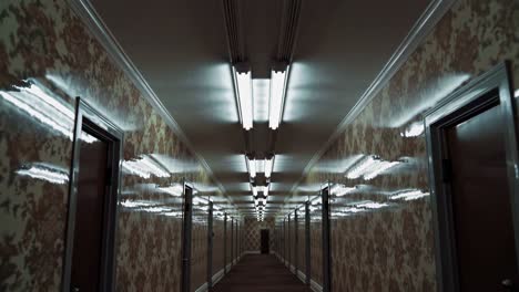 empty hotel corridor with floral wallpaper