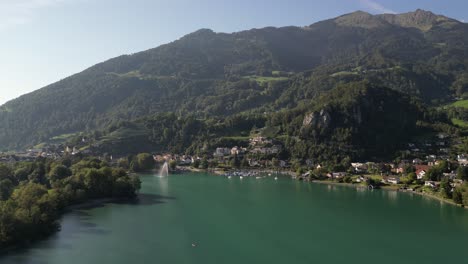 Breathtaking-aerial-view-of-mountain-village-on-a-lake