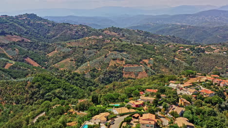 tanneron france aerial v19 establishing dolly in shot capturing housing estates at les mauberts, high altitude hillside plantation and pristine mountainous landscape - july 2021