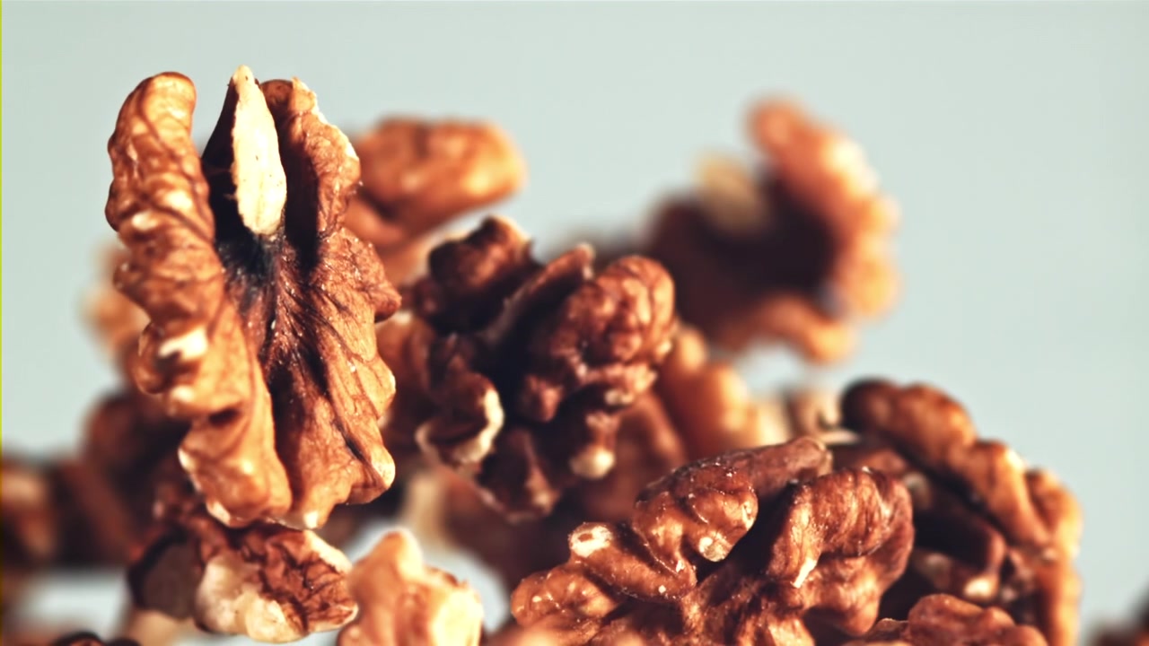 Walnuts Rising and Falling in Slow Motion