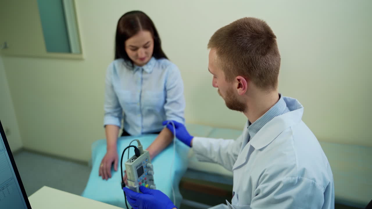 Doctor checks reflex of patient hand. Neurologist testing hand reflex on female patient