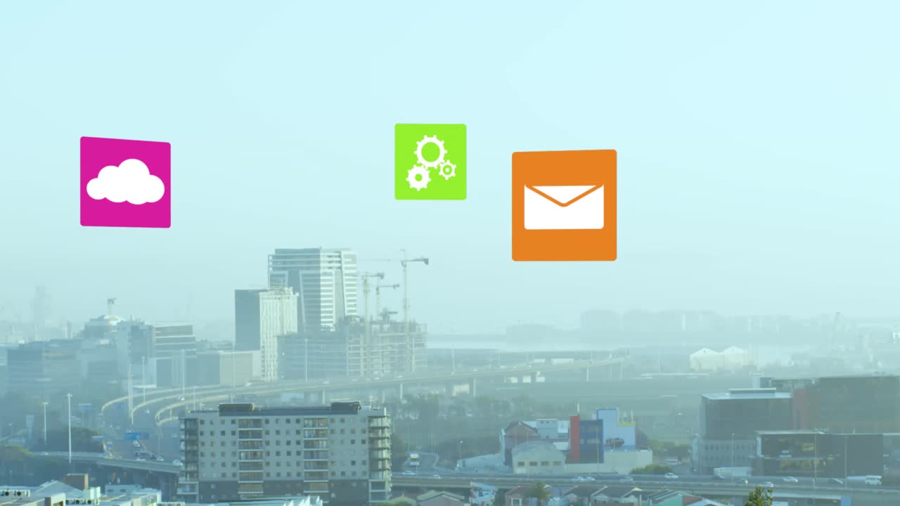 Animation of multiple digital icons against aerial view of cityscape