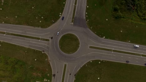 aerial view crossroad cars move around circle