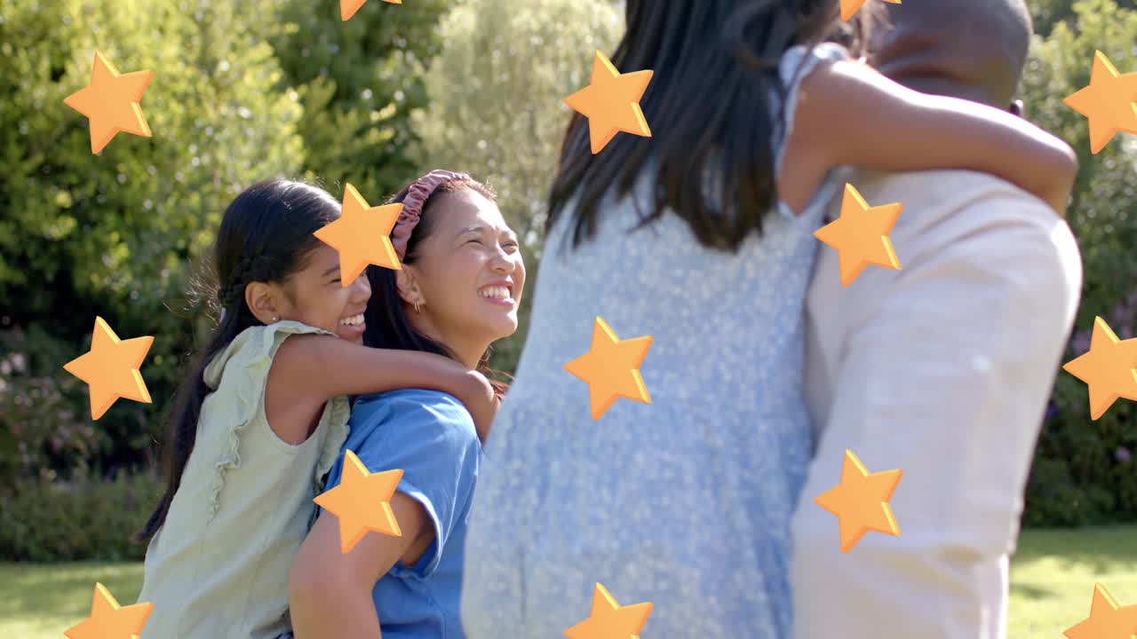 Woman piggybacking girl turning to greet nearby adult, orange stars passing in front in family park