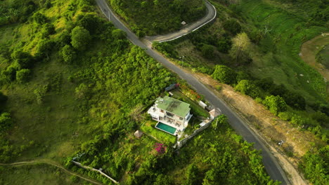 House-on-hill-with-spectacular-view-on-exotic-Lombok-landscape-Indonesia,-aerial
