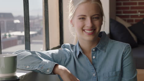 portrait beautiful young woman looking out window smiling happy enjoying successful lifestyle relaxing at home