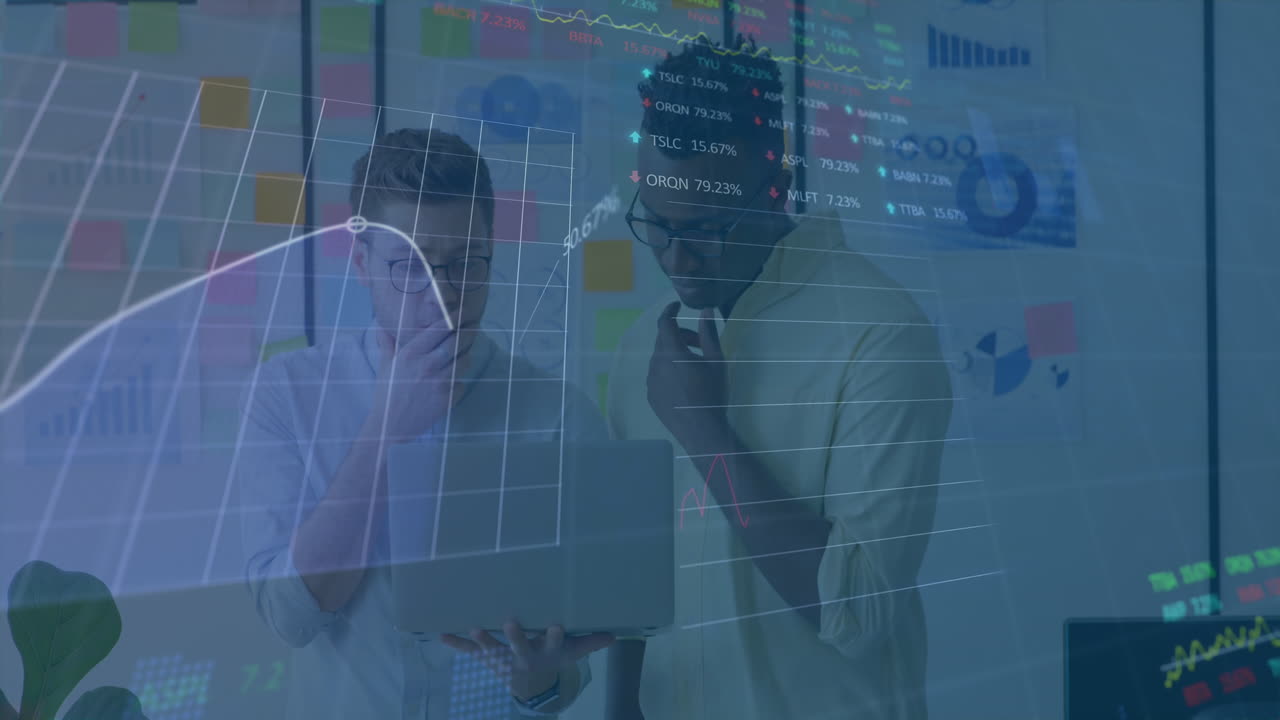Animation of stock market data processing against two diverse men discussing over a laptop at office