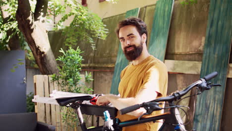 Male-cyclist-carrying-bicycle-toolbox