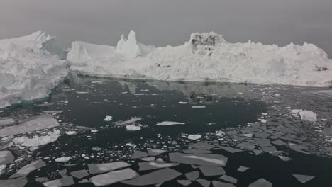 drone over sea and ice of ilulissat icefjord