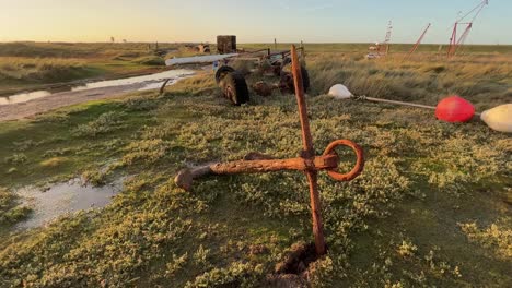 Rusty-old-anchor-on-the-beach-at-Gibraltar-Point-Lincolnshire,-England