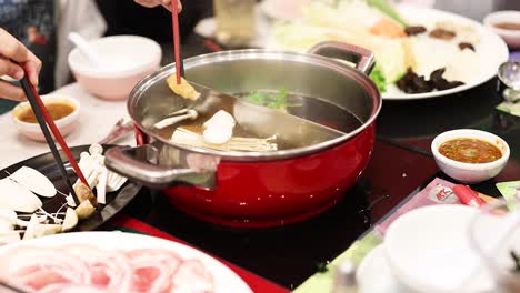 cooking and sharing hotpot with friends