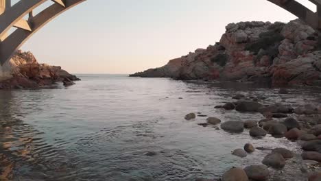 video of beautiful view of the sea coast with bridge and rocks
