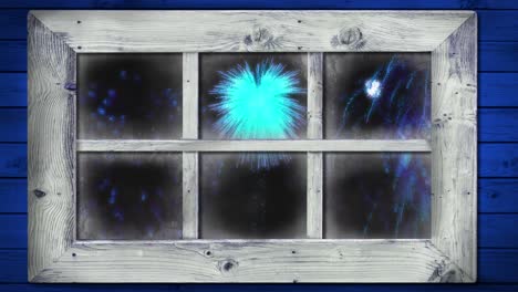 animation of window with blue christmas and new year fireworks in night sky