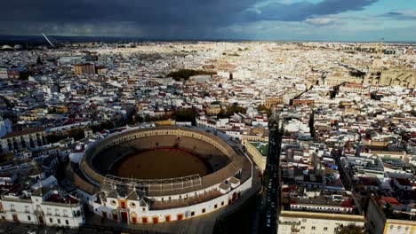 Aerial-pan-across-sewilla-spain-city-with-storm-clouds-behind